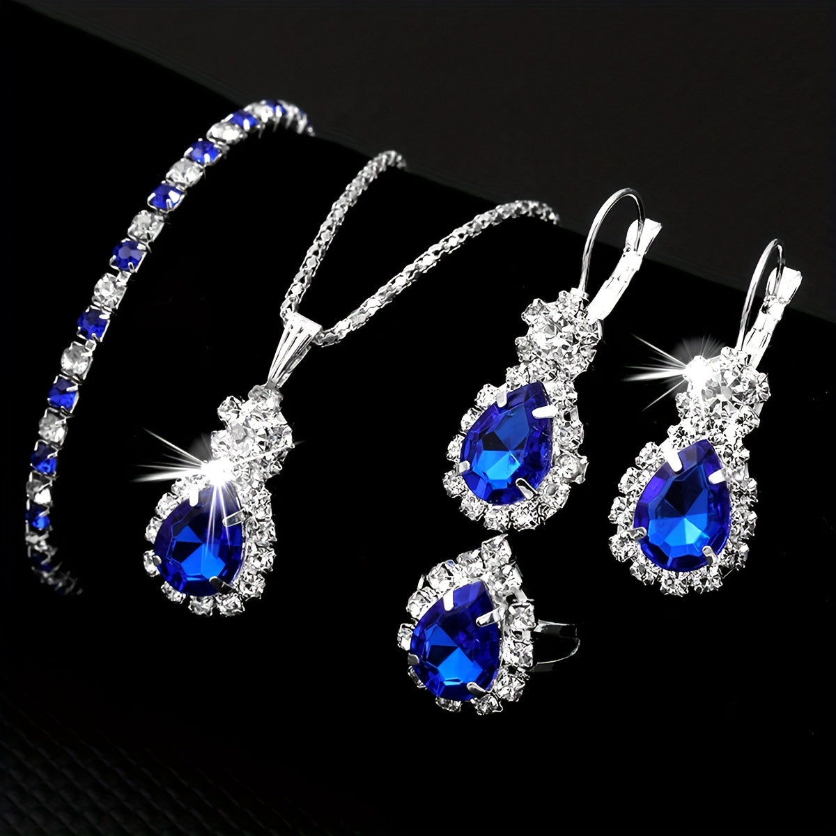 Dazzling Blue Teardrop Jewelry Set for Women - Timeless Elegance in Stainless Steel, 4-Piece Luxurious Style Ensemble, Including Necklace, Bracelet, Ring, and Stud Earrings