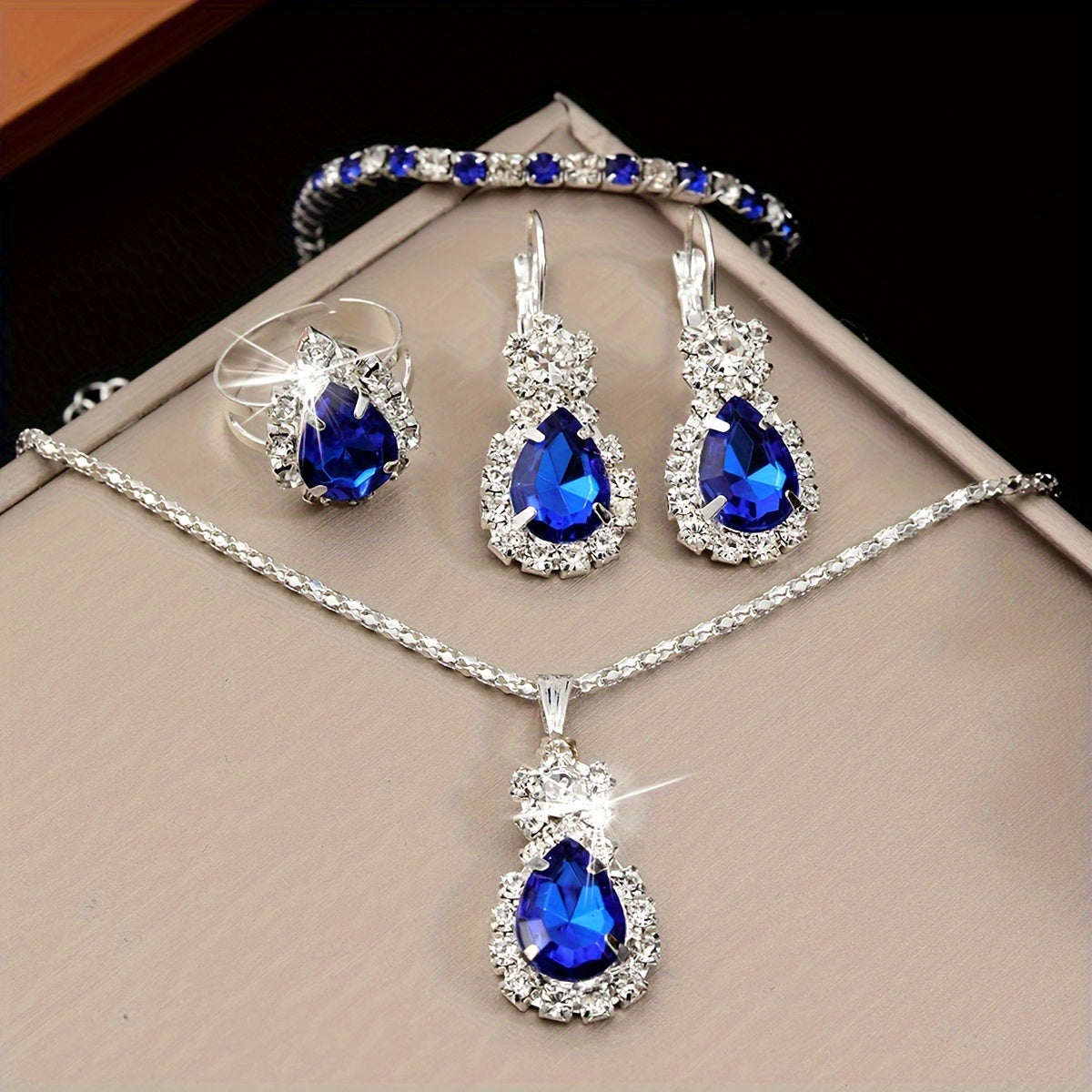 Dazzling Blue Teardrop Jewelry Set for Women - Timeless Elegance in Stainless Steel, 4-Piece Luxurious Style Ensemble, Including Necklace, Bracelet, Ring, and Stud Earrings