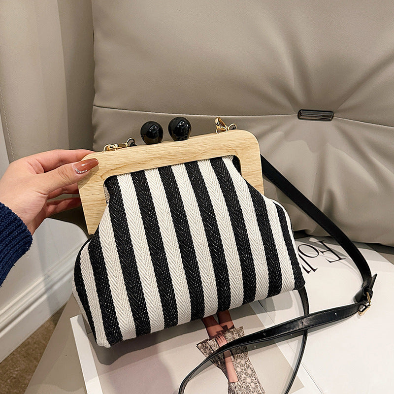 LOVECCR 2025 popular new women's bag fashion striped canvas wooden clip clutch bag New Internet celebrity shoulder messenger bag