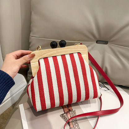 LOVECCR 2025 popular new women's bag fashion striped canvas wooden clip clutch bag New Internet celebrity shoulder messenger bag