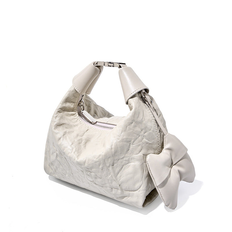 LOVECCR 2025 Spring and summer new pleated new Chinese niche hand-held flower first layer cowhide dumpling bag hand-held oblique span solid color simple style