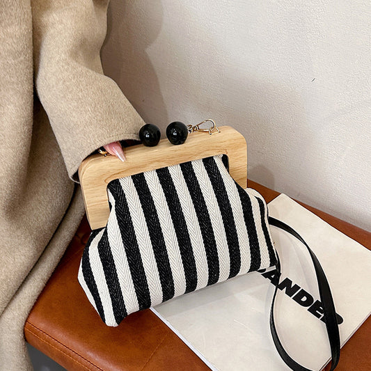 LOVECCR 2025 popular new women's bag fashion striped canvas wooden clip clutch bag New Internet celebrity shoulder messenger bag