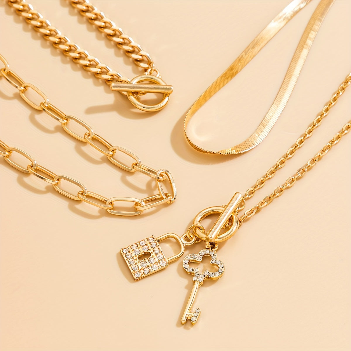 4pcs Vintage Sparkling Snake Chain Necklace Set - Sleek Flat Design with Intricate Rhinestone Key & OT Buckle Pendants - Uniquely Cool Street Style Accessory for Trendsetters